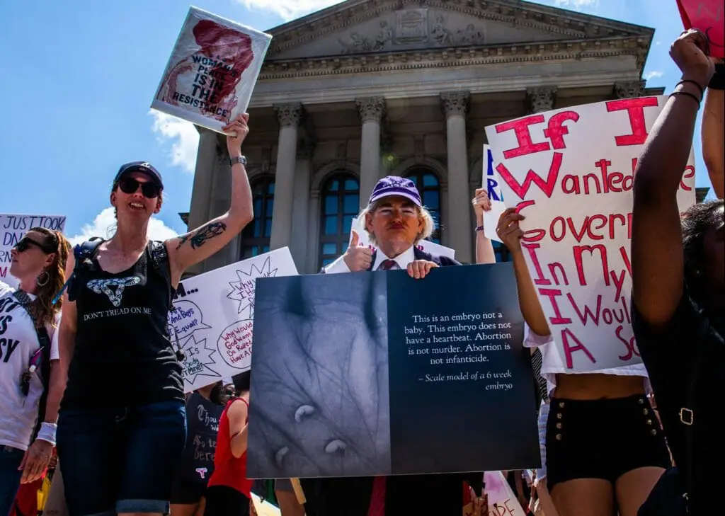 data-src="https://www.mainlineatl.com/wp-content/uploads/2020/08/abortion-richard-martin-2-1024x729.jpg"