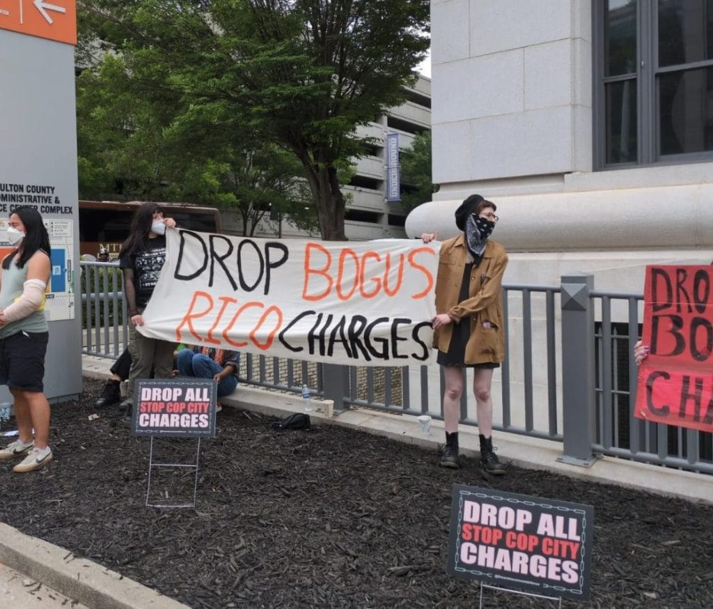 Local demonstrators gathered outside the Fulton County courthouse on Wed., May 14, in support of the 61 people indicted with RICO for their protest against Cop City. Supporters are demanding all charges be dropped. Photo credit: Stop Cop City Instagram page, 2025.